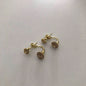 Set de Aretes Dorados con Detalles Marinos y Brillantes